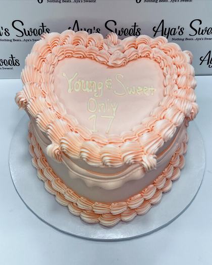 A heart piped in pink, a custom cake made by Aya's Sweets