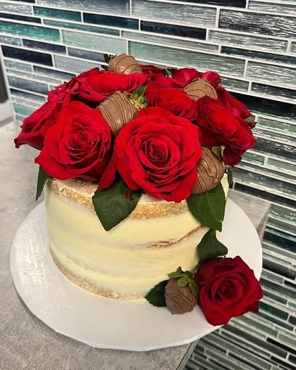 Red roses on bare buttercream, a cake made by Aya's Sweets