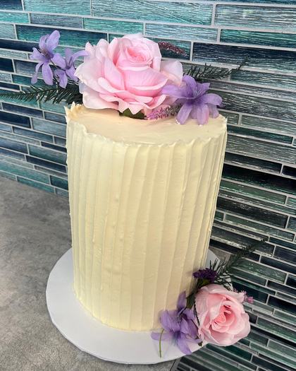 Ribbed buttercream, one rose, a cake made by Aya's Sweets