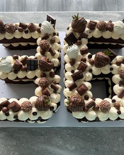 Numbers built from chocolate, a custom cake made by Aya's Sweets