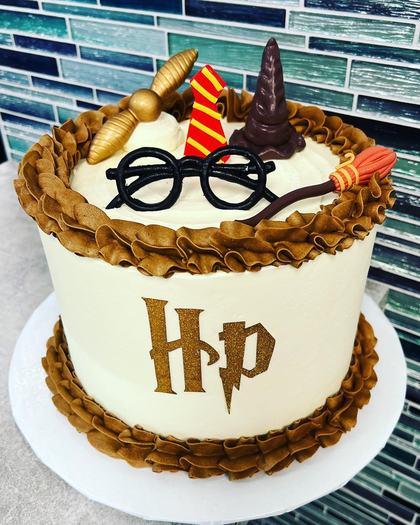 Harry Potter, glasses and all, a custom cake made by Aya's Sweets